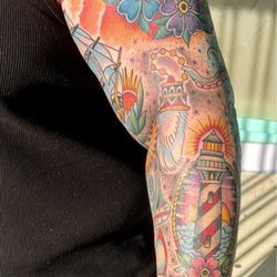 Fine Line Tattoo - Forearm, lighthouse, astrological sign, rabbits foot, red ray ban memorial