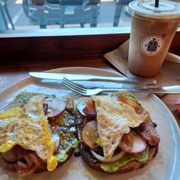 Avacado toast w/ eggs, bacon, and sourdough bread