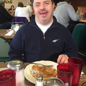 Yellow Rose Cafe - Johnny loving his Combo breakfast. Eggs, ham off the bone, and fluffy pancakes. Can you see the happiness?! - Diners Near Me - Chicago, Illinois