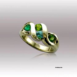 Irv's Jewelry Rocks & Gifts - Mother's ring in 14k Gold with Emerald, Aquamarine, Peridot and Tourmaline.