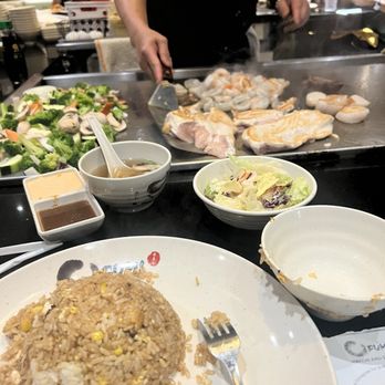 Fumi Hibachi Sushi and Bar - The chef showing off his cooking skills - Sushi Bars Near Me - Duluth, Georgia Fumi Hibachi Sushi and Bar - The chef showing off his cooking skills - Sushi Bars Near Me - Duluth, Georgia