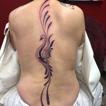 The Ink Spot - Purple peacock design - Tattoo Near Me