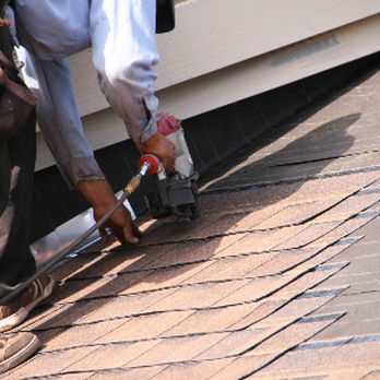 Royal T. Construction - a man working on a roof - General Contractors Near Me - Neodesha, Kansas Royal T. Construction - a man working on a roof - General Contractors Near Me - Neodesha, Kansas