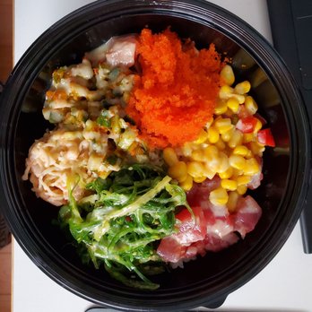 Pacific Poke - a bowl of food on a table - Poke Near Me - Vancouver, British Columbia Pacific Poke - a bowl of food on a table - Poke Near Me - Vancouver, British Columbia