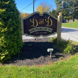 D and D Hair Designs & Day Spa - Sign on road