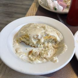 This is the remnants of my side of ONE biscuit & gravy. It filled the entire bowl! This is the remnants of my side of ONE biscuit & gravy. It filled the entire bowl!
