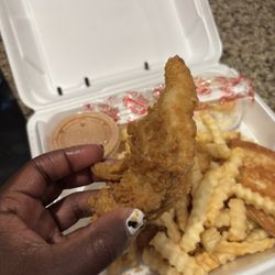 Raising Cane's Chicken Fingers - Chicken tender and fries