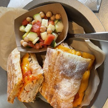 Aioli - Turkey and cheddar on chabatta side of chickpeas with kvinigar a s dill - Cafes Near Me - West Palm Beach, Florida Aioli - Turkey and cheddar on chabatta side of chickpeas with kvinigar a s dill - Cafes Near Me - West Palm Beach, Florida