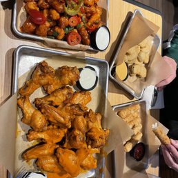 We over ordered! 20 Boneless Wings. Cauliflower wings. Mozzarella sticks. Fried pickles.