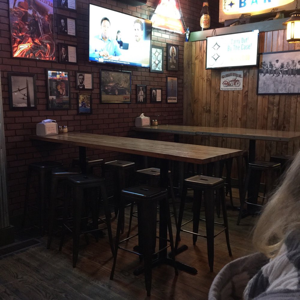 McKelvey's Pub - a woman sitting at a bar - Pizza Near Me - Millersburg, Ohio McKelvey's Pub - a woman sitting at a bar - Pizza Near Me - Millersburg, Ohio