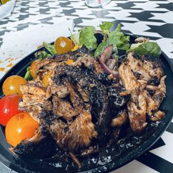 Scotch Bonnet - Jerk Chicken over field greens, onion, cucumber, and tomato. "Smoked" Jerk Sauce added as well. Amazing!!!