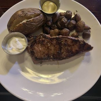 Back Room Steakhouse - Steak with mushrooms and baked potato - Steakhouses Near Me - Apopka, Florida