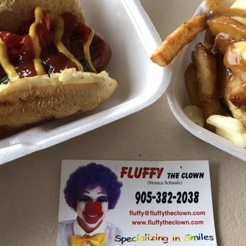 Nikos Place - Here is an example of the great food  Poutine and dog! Oh yea found Fluffy's creepy Card there - Canadian (New) Near Me - Niagara Falls, Ontario
