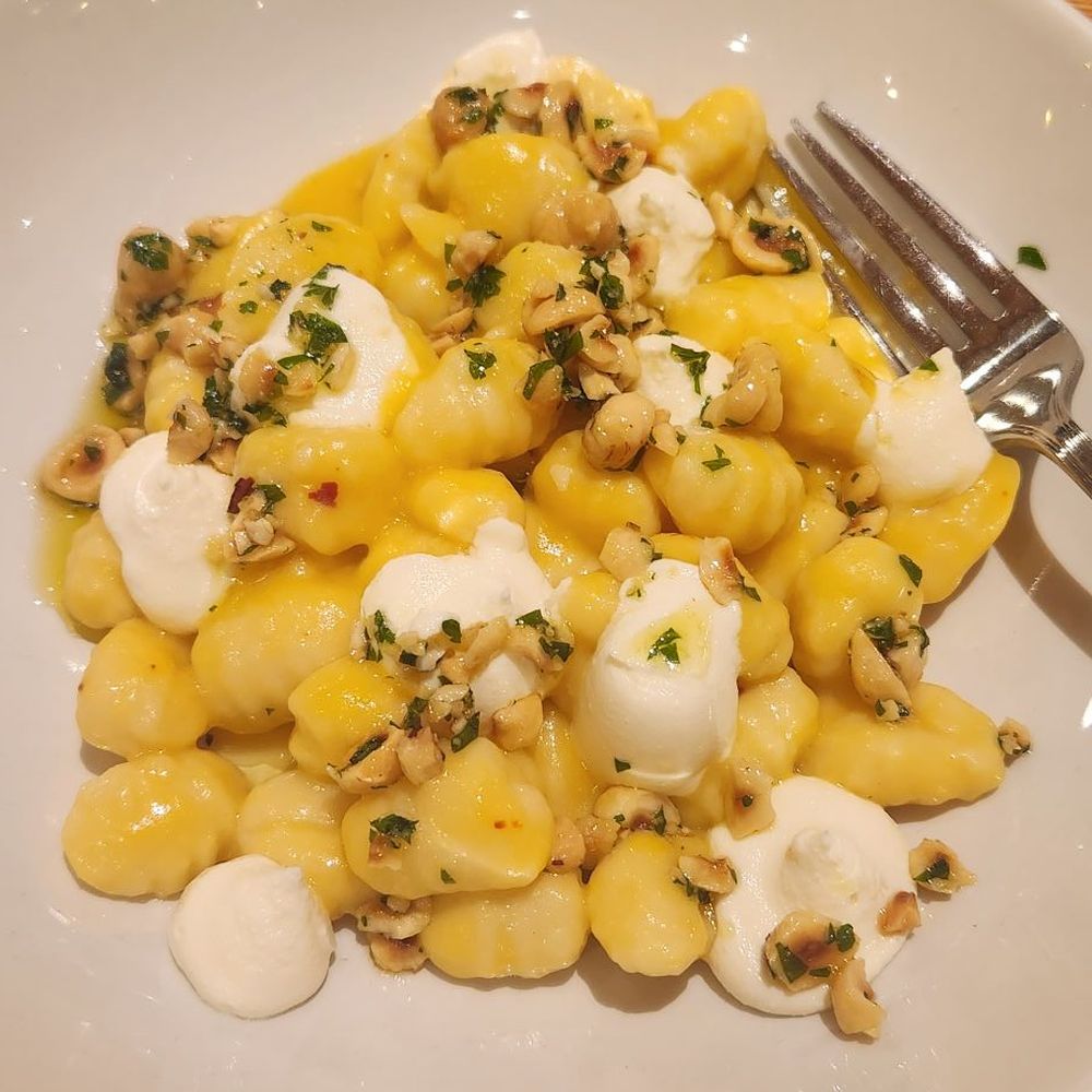 Cortina - Potato gnocchi with squash sugo, ricotta, and hazelnut - Italian Near Me - Seattle, Washington Cortina - Potato gnocchi with squash sugo, ricotta, and hazelnut - Italian Near Me - Seattle, Washington