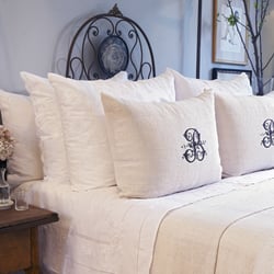 Machine washable Hungarian Goose down pillows dressed with fine monogrammed linens