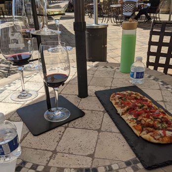 Las Positas Vineyards - Flatbread and wine tasting from wine glass tree stand during covid - Wineries Near Me - Livermore, California Las Positas Vineyards - Flatbread and wine tasting from wine glass tree stand during covid - Wineries Near Me - Livermore, California