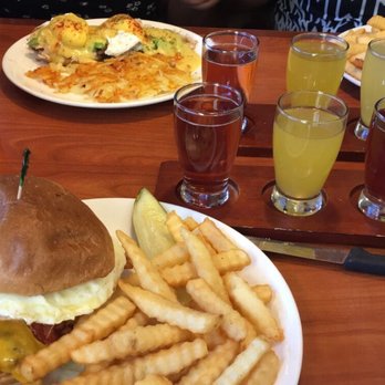 Broken Yolk Cafe - A 5$ paddle of mimosas. (Different flavors) Egg Benedict with hash browns and a Morning Burger - Breakfast & Brunch Near Me - La Quinta, California