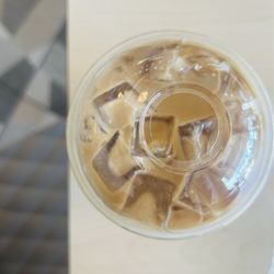 Sleek Crêperie | Café -- Fairfield - Iced oat milk flat white with sugar free caramel (super milk and sugar forward)