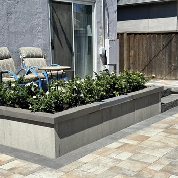 Kay Green Landscape - Raised paver patio with modular planter - Landscaping Near Me