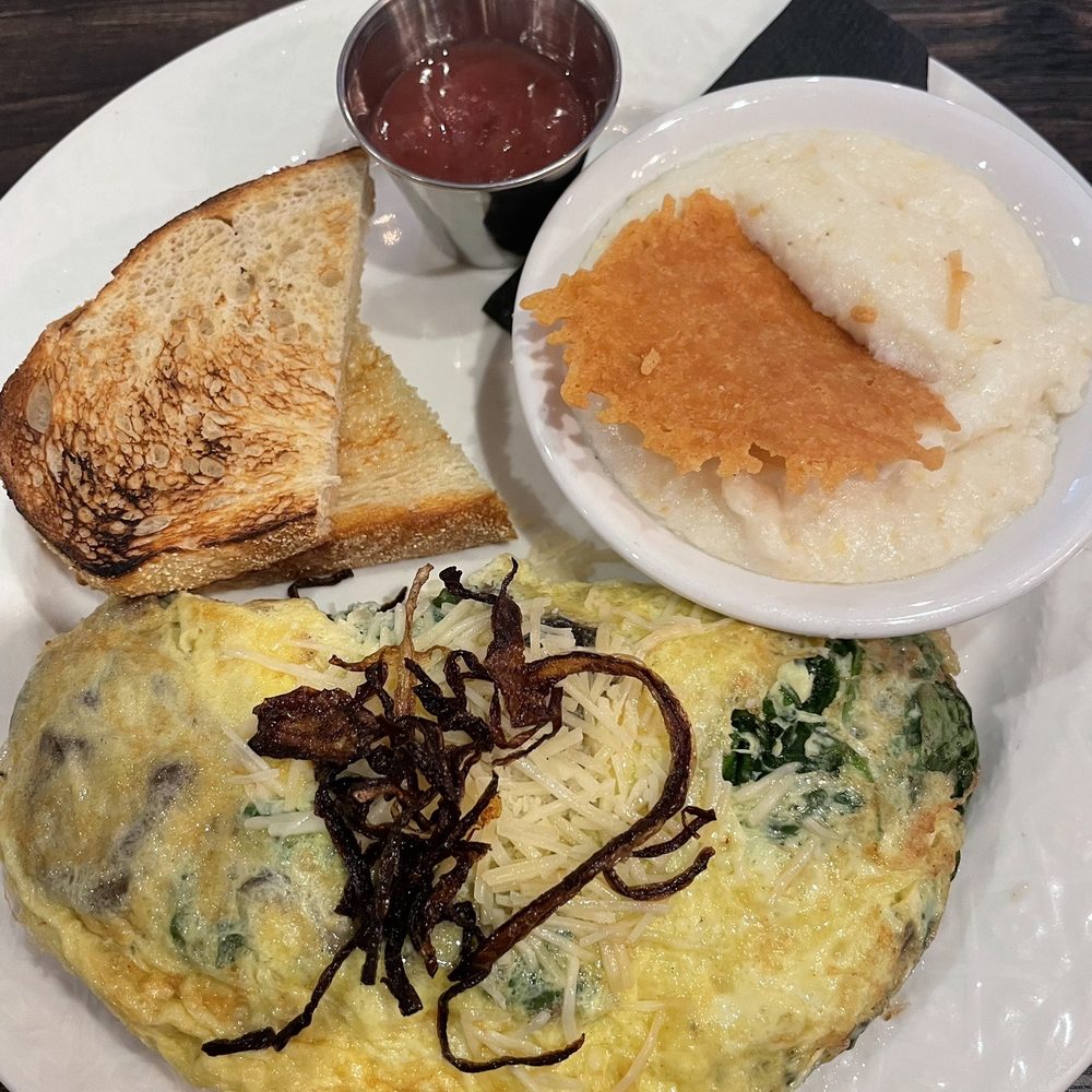 Mushroom omelette with side of cheese grits and toast/jelly Mushroom omelette with side of cheese grits and toast/jelly