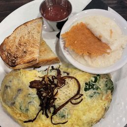 Mushroom omelette with side of cheese grits and toast/jelly Mushroom omelette with side of cheese grits and toast/jelly