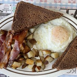 Kozy Kitchen - Fried eggs, bacon, home fries, and toast.