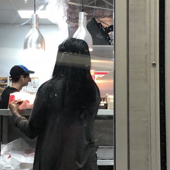 Dairy Queen - a woman ordering food from a counter - Fast Food Near Me - Willis, Texas