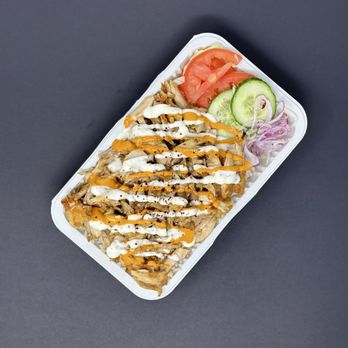 Viva Shawarma - a plate of food on a table - Mediterranean Near Me - North York, Ontario Viva Shawarma - a plate of food on a table - Mediterranean Near Me - North York, Ontario