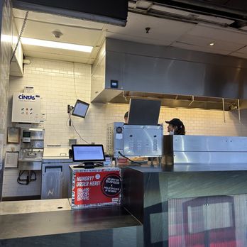 Burger Bar - a woman behind the counter - Burgers Near Me - Austin, Texas