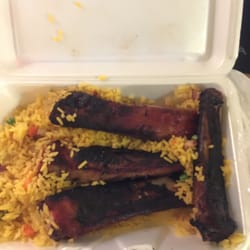 A1 Kitchen - 4 burnt ribs and barely any rice. Don't ever order from here. Food is terrible. Service is terrible.