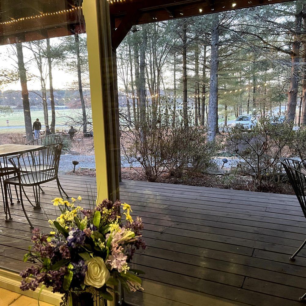 Hidden Brook Winery - Outdoor Tree Stand view from inside the log cabin - Wineries Near Me - Leesburg, Virginia Hidden Brook Winery - Outdoor Tree Stand view from inside the log cabin - Wineries Near Me - Leesburg, Virginia