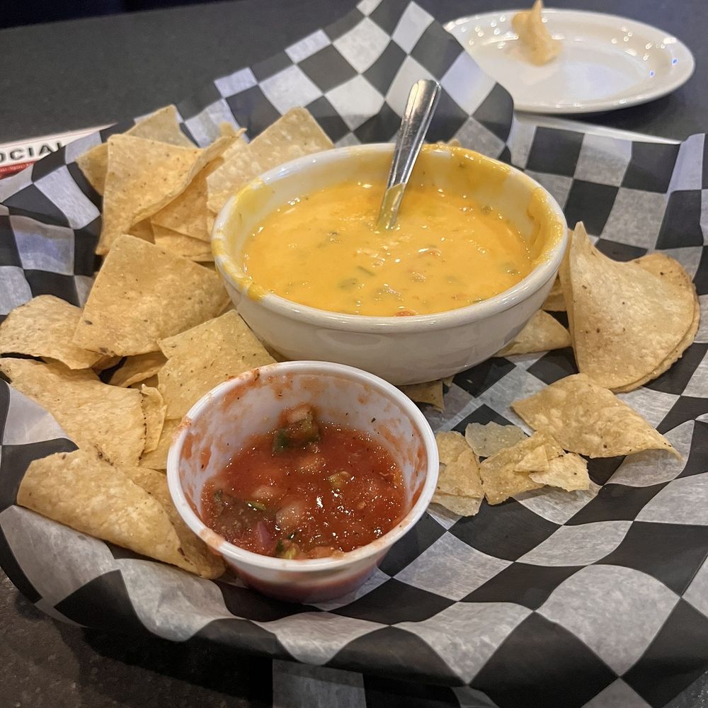 Louie's Grill and Bar - Their queso is great. It doesn't harden or get cold over time unlike many other queso dishes. Salsa needs salt but it's delicious - American Near Me - Edmond, Oklahoma Louie's Grill and Bar - Their queso is great. It doesn't harden or get cold over time unlike many other queso dishes. Salsa needs salt but it's delicious - American Near Me - Edmond, Oklahoma