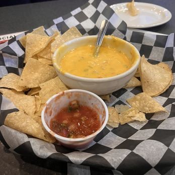 Louie's Grill and Bar - Their queso is great. It doesn't harden or get cold over time unlike many other queso dishes. Salsa needs salt but it's delicious - American Near Me - Edmond, Oklahoma Louie's Grill and Bar - Their queso is great. It doesn't harden or get cold over time unlike many other queso dishes. Salsa needs salt but it's delicious - American Near Me - Edmond, Oklahoma