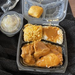 Corinne's Place - Smothered chicken dinner, side of cabbage and corn bread.