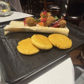 Edge Steakhouse - Bone marrow starter with elk bone, carrot, beet and micro-greens. Arepas and bone marrow mouse. - Steakhouses Near Me - Park City, Utah