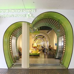 Visitor Concierge Services by Roberts Hawaii - Located at Ala Moana Center, Street Level 1, Ewa Wing (next to Jean's Warehouse). Here's a helpful exterior photo.