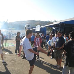 The crowd looks on as the BFA athlete attempts a trick.