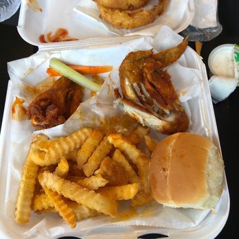 The Chicken Coop - a sandwich and onion rings - Chicken Wings Near Me - Holly Springs, Mississippi The Chicken Coop - a sandwich and onion rings - Chicken Wings Near Me - Holly Springs, Mississippi