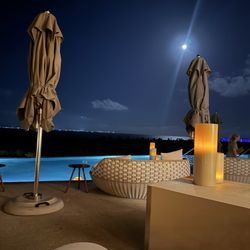 Atelier Playa Mujeres - Rooftop pool view at night