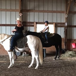 My daughter getting ready to head out of the stable. My daughter getting ready to head out of the stable.