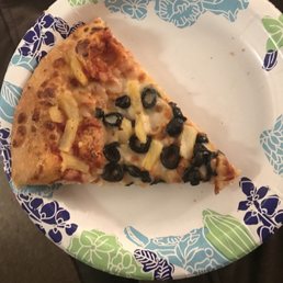 a slice of pizza on a paper plate