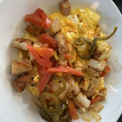 Waffle House - Fiesta Chicken Protein Bowl Fresh sautéed jalapeño, diced onions and tomatoes. Scrambled eggs.