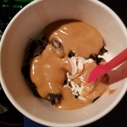 a person holding a spoon in a bowl a person holding a spoon in a bowl