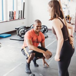 Simple Solutions Fitness - Steven coaching Emma on how to hinge using a dowel