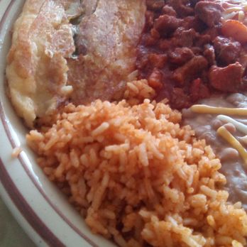 El Charro Mexican Grill - El Charro's combo plate: rice, beans, chile relleno, red chile con carne, and and enchilada. The chile pepper was not a flavorful one. - Food Trucks Near Me - Las Cruces, New Mexico