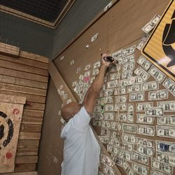 Stumpy's Hatchet House - Fairfield - Place a buck for luck on the wall.