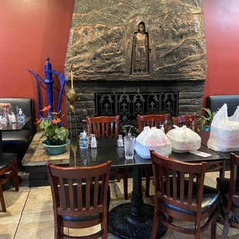 DeAfghanan Cuisine - Replica of the Buddha of Bamiyan in the dining room - Afghan Near Me - Fremont, California DeAfghanan Cuisine - Replica of the Buddha of Bamiyan in the dining room - Afghan Near Me - Fremont, California