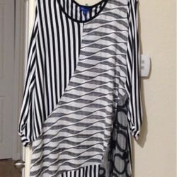 Unique Treasures - I bought this great top for an event and I love the way it fits. Very unique look