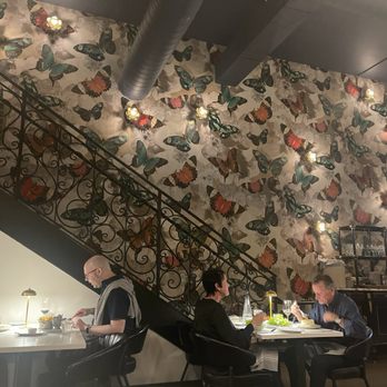 Augie's French - Enjoying dinner next to a stunning wall covered in butterflies. - French Near Me - Santa Rosa, California