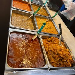 Curryland Indian Food - So bombbb three entrees is never enough! Today I got the garbanzo beans, cauliflower w potato, goat curry as always, and veg korma